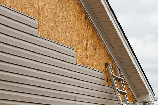 Professional Emergency Siding Repair technician working in Sharon, MA